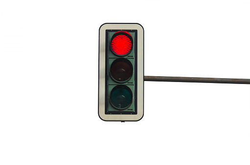 Traffic lights, against white background, with red light.