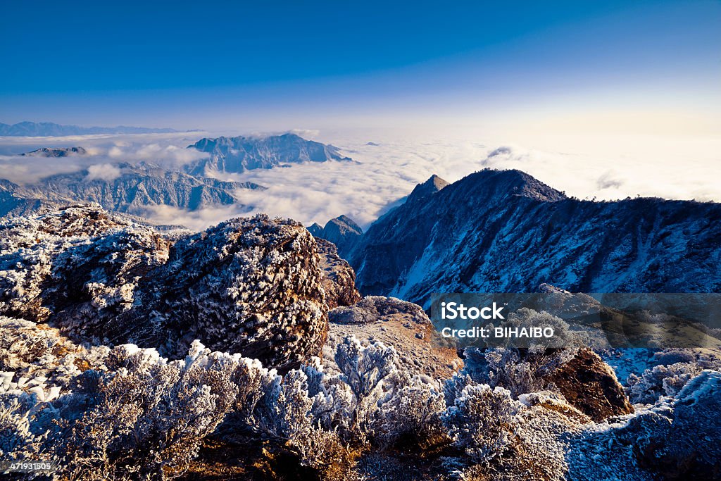 Beauty In Nature climb up top of “cattle's back” mountain with 3600 meters to take pictures of Minya Konka. Asia Stock Photo