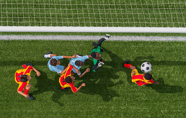 istock Young Boys Playing Football 471931705