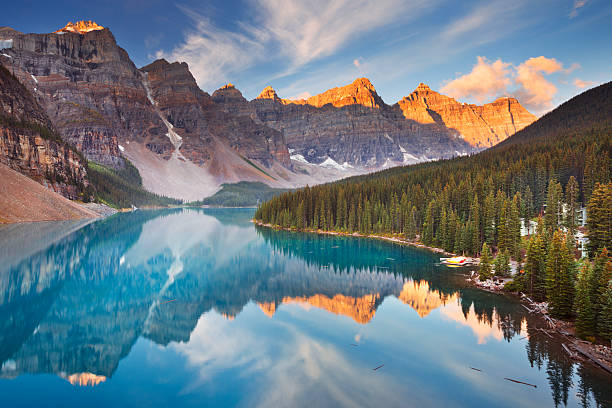 Moraine Lake at sunrise, Banff National Park, Canada Beautiful Moraine Lake in Banff National Park, Canada. Photographed at sunrise. moraine lake stock pictures, royalty-free photos & images