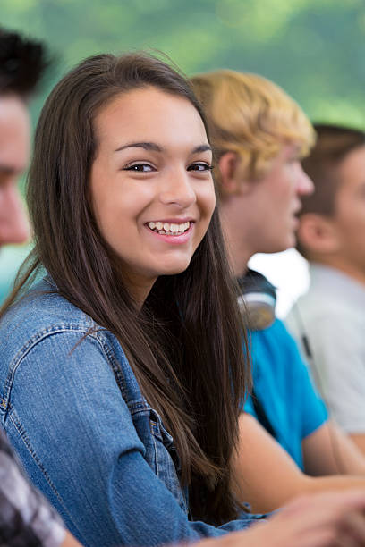 istock Latin American teenager smiling during high school class 471932115