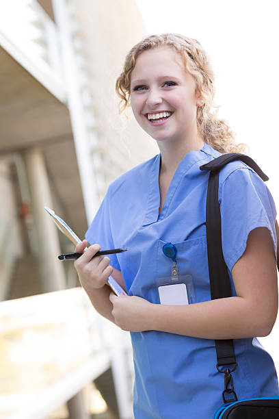 istock Young medical or nursing student walking on college campus 471932299