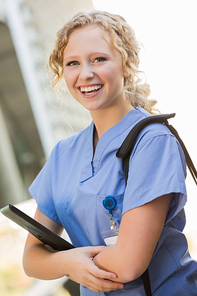 istock Cute nursing or medical student walking to class outside college 471932331
