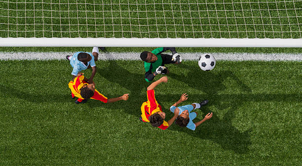 istock Young Boys Playing Football 471932371