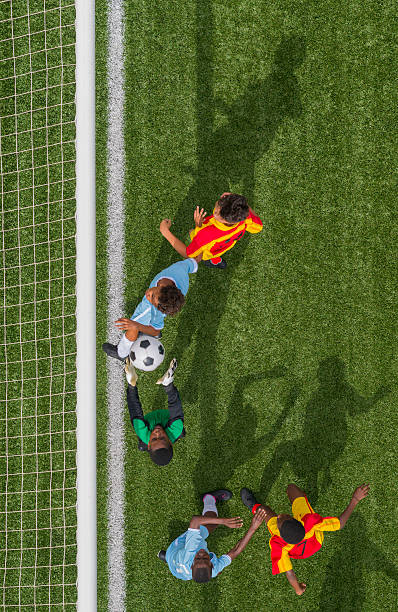 istock Young Boys Playing Football 471932383