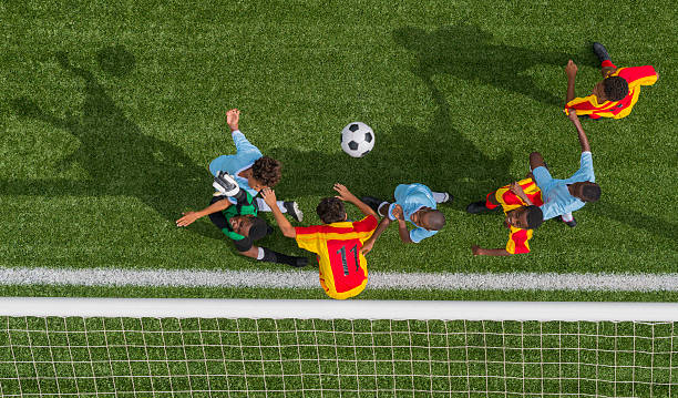 istock Young Boys Playing Football 471932423