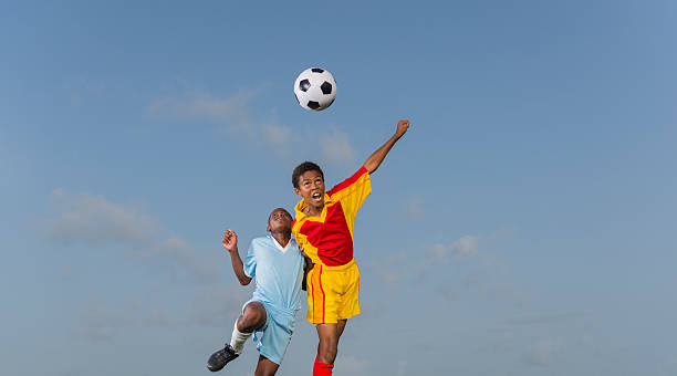 istock Two Young Boys Playing Football 471932599