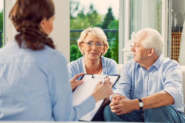 istock Senior couple talking with insurance agent 471932639