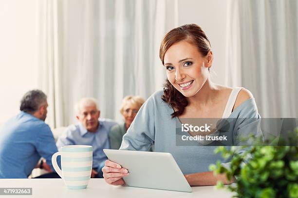 Woman With Digital Tablet At Home Stock Photo - Download Image Now - 30-34 Years, 30-39 Years, Active Seniors