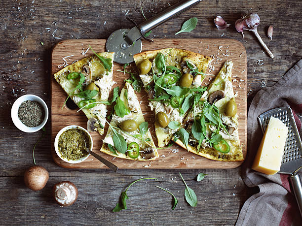 istock Artistic overhead view of veggie pizza cooked on wood board 471934175