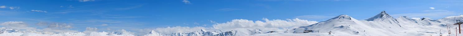 High mountain snowy  landscape. The italian alps in winter. Livigno. Panorama made from multiple images.