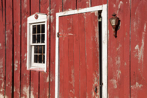 istock Red Barn Door and Window Afternoon Sunlight 471936893