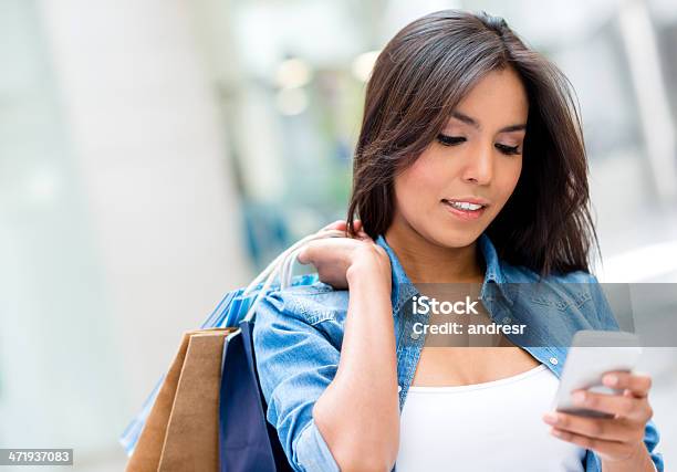 Woman Checking Her Cell Phone Stock Photo - Download Image Now - 20-24 Years, Adult, Adults Only