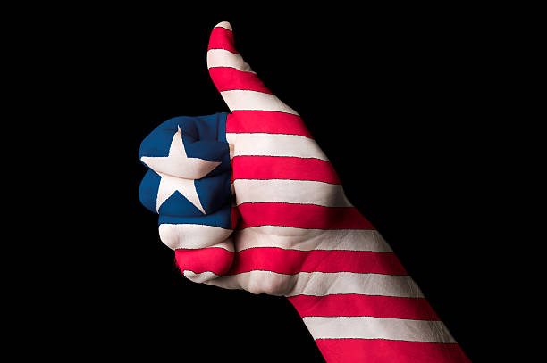 istock liberia national flag thumb up gesture for excellence 471937597