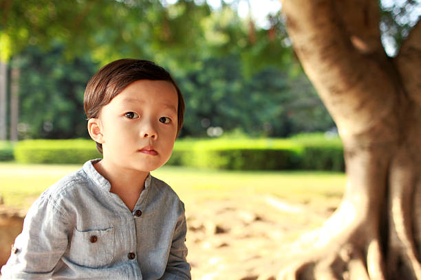 istock Cute children playing in the park 471937791