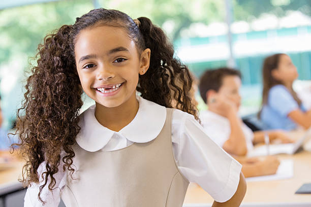 istock Adorable mixed race student in private school uniform 471938209