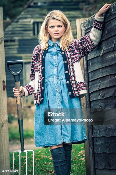 Young Woman With Pitchfork Iii Stock Photo - Download Image Now - 20-24 Years, 20-29 Years, 25-29 Years