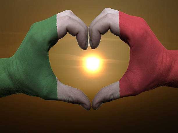 istock Heart and love gesture by hands colored in italy flag 471939903