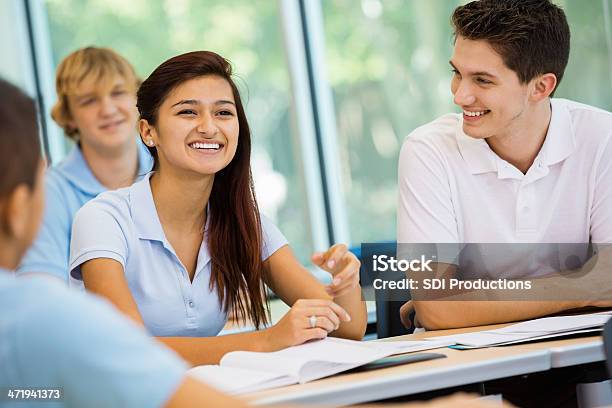 Student Answering Teachers Question In Private High School Classroom Stock Photo - Download Image Now