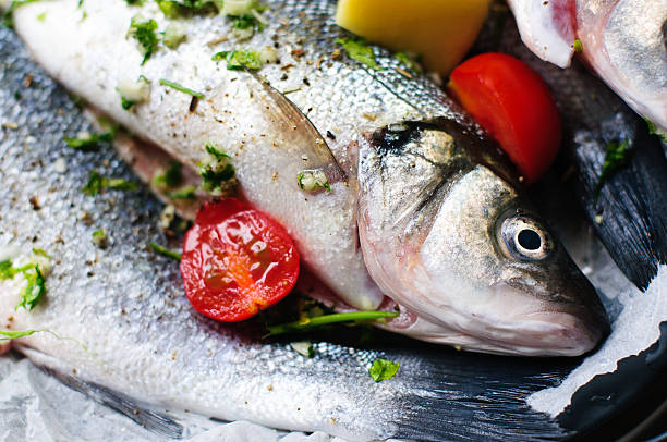 The sea basses, cooked with garlic, potatoes, tomatoes, pepper, parsley, are one of the most delicate italian fish plates. Tomatoes are of the special variety \