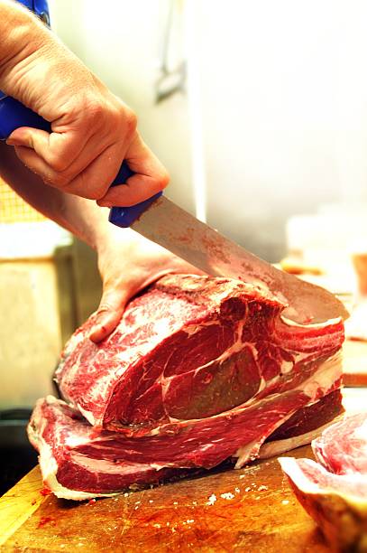 istock butcher cutting beef rib steak 471942725