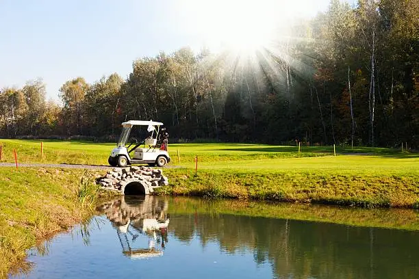 Golf-cart car on golf course landscape