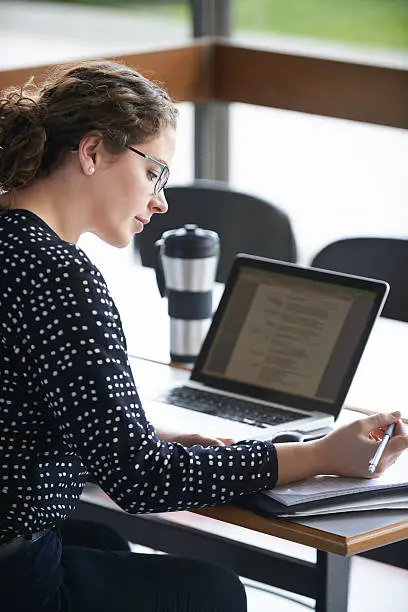 Cropped shot of an attractive young woman studying in the university libraryhttp://195.154.178.81/DATA/i_collage/pu/shoots/804548.jpg