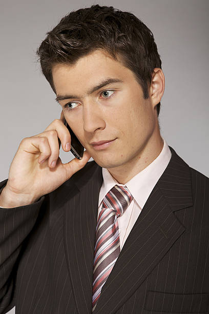 istock Young caucasian businessman talking on phone 471944084