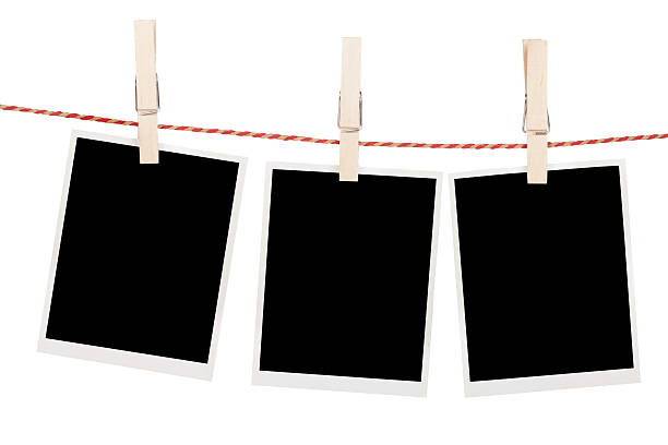 istock Blank photos hanging on clothesline 471945901