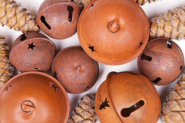Group of rustic jingle bells and pine cones for a background