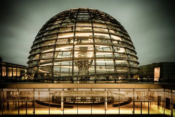 Berlin Reichstag Dome at Twilight. Spiral stairways to the top of the Reichstag, Germany's parliament building in the heart of Berlin, Central Berlin, Germany.