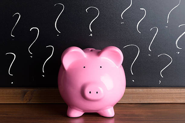 istock Piggy Bank With Question Mark On Black Board 471947728