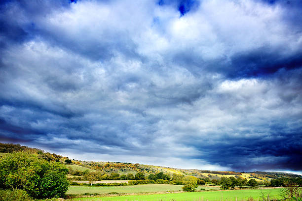 istock Green hills under moody sky 471947807