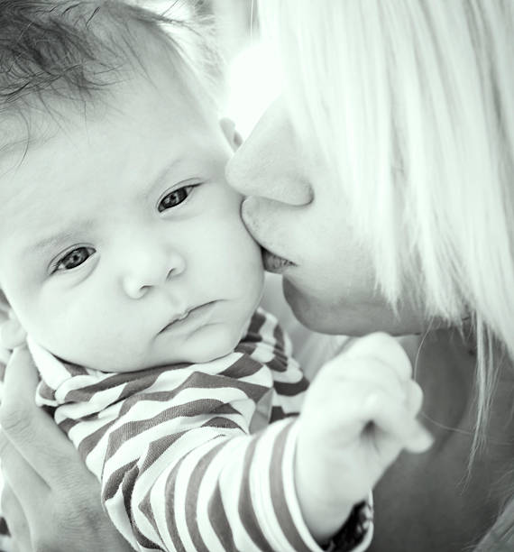 istock Mother Kissing her Baby 471947911