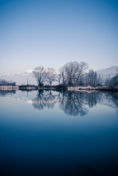 istock cold lake at winter, Torbiere del Sebino 471948680