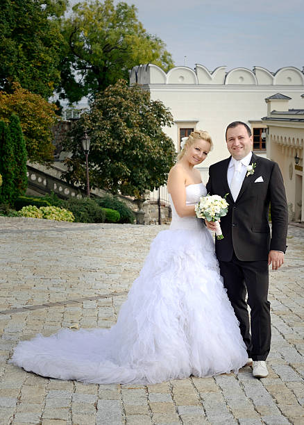 istock Newlywed couple posing 471949529