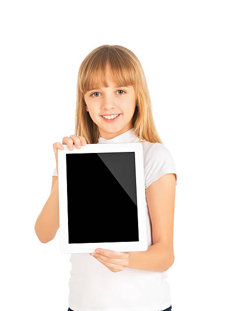 istock happy child girl with blank tablet computer 471950447