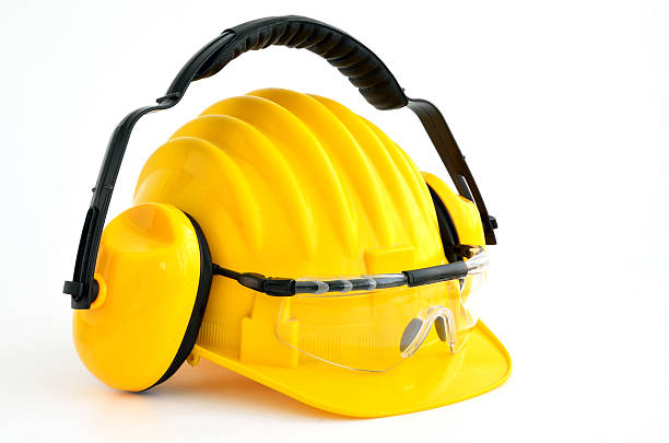 istock hard hat, goggles and ear muffs isolated on white 471950683