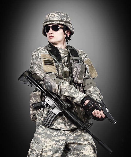 istock US soldier holding gun 471951762