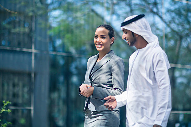 istock Middle Eastern business couple talking in the street 471952004