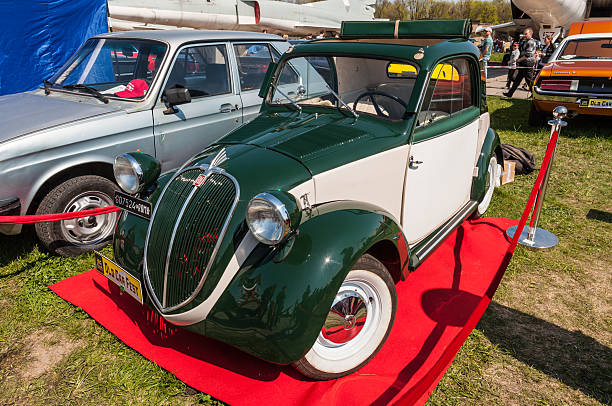 Italian fiat 500 Topolino vintage car Kyiv, Ukraine - April 26, 2015: The festival "Old Car Fest 2015", showed an elegant vintage Fiat 500 car, commonly known as "Topolino" literally meaning "Little Mouse" in Italian in Kiev, Ukraine. fiat 500 topolino stock pictures, royalty-free photos & images