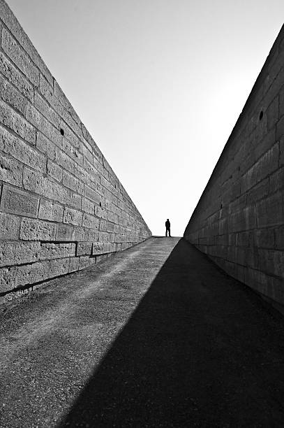 istock stone-alley-man-silhouette 471952183