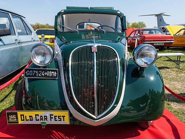 Frontal view of the famous Fiat 500 Topolino Kyiv, Ukraine - April 26, 2015: The festival "Old Car Fest 2015", showed an elegant vintage Fiat 500 car, commonly known as "Topolino" literally meaning "Little Mouse" in Italian at April 26, 2015 in Kiev, Ukraine. fiat 500 topolino stock pictures, royalty-free photos & images