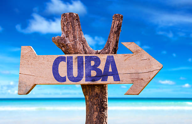 Cuba wooden sign with beach background Cuba wooden sign with beach background baracoa stock pictures, royalty-free photos & images