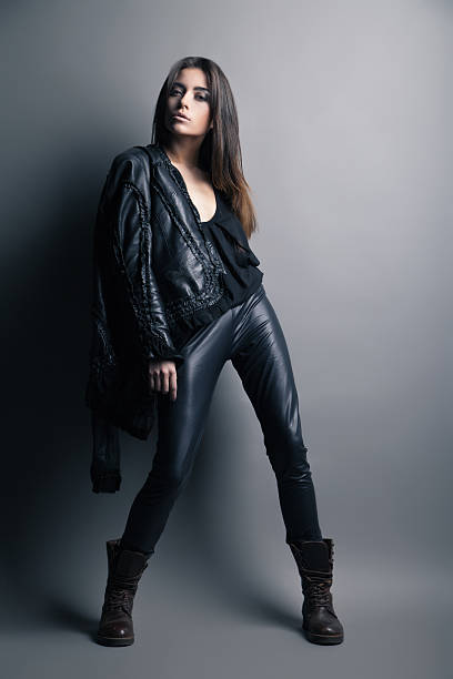 istock Fashion model wearing leather pants and jacket 471957039