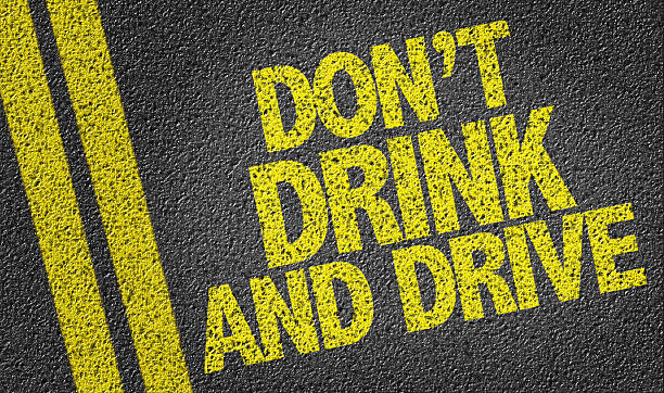 istock Don't Drink and Drive written on the road 471957484