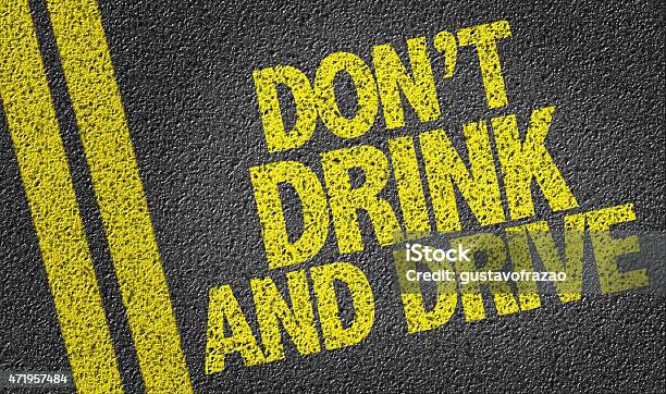 Dont Drink And Drive Written On The Road Stock Photo - Download Image Now - Drunk Driving, Alcohol - Drink, Driving
