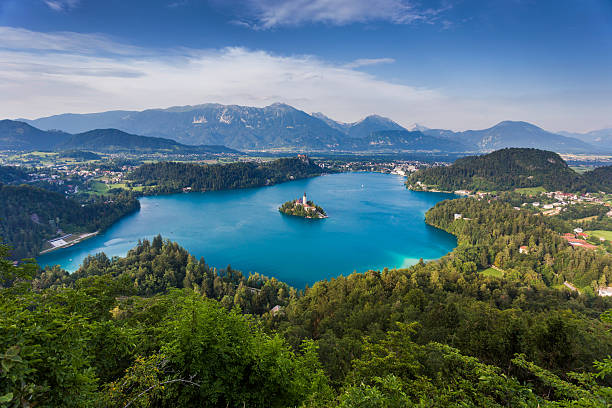 istock Blue lake surrounded by forest in Slovenia 471957558