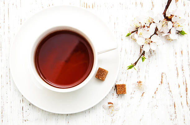 istock Cup of tea and spring blossom 471957932