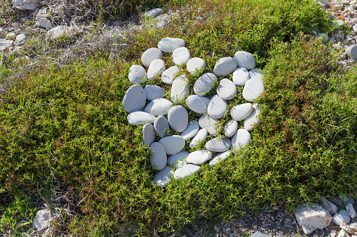 Stones heart on the grass, Limassol, Cyprus
